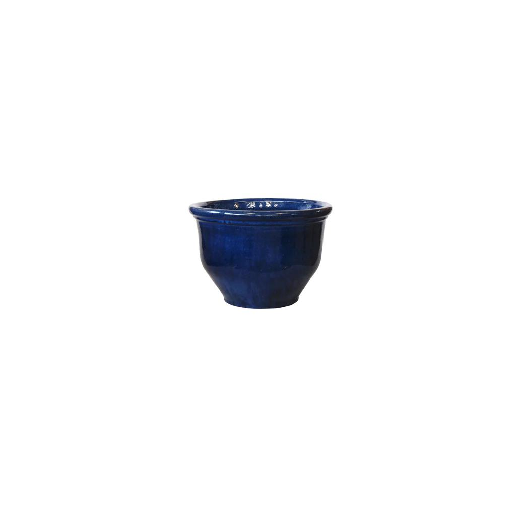 Glossy blue ceramic plant pot with wide rim on white background
